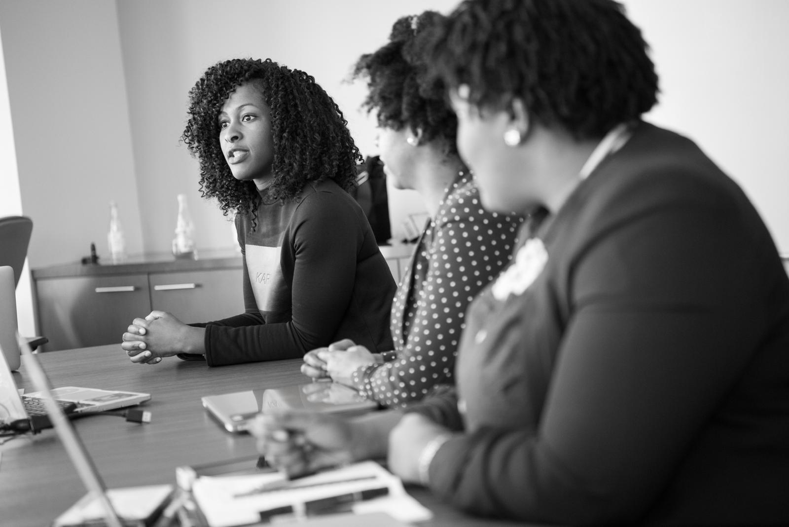 Leadership Learning Sessions: women in discussion around a boardroom table