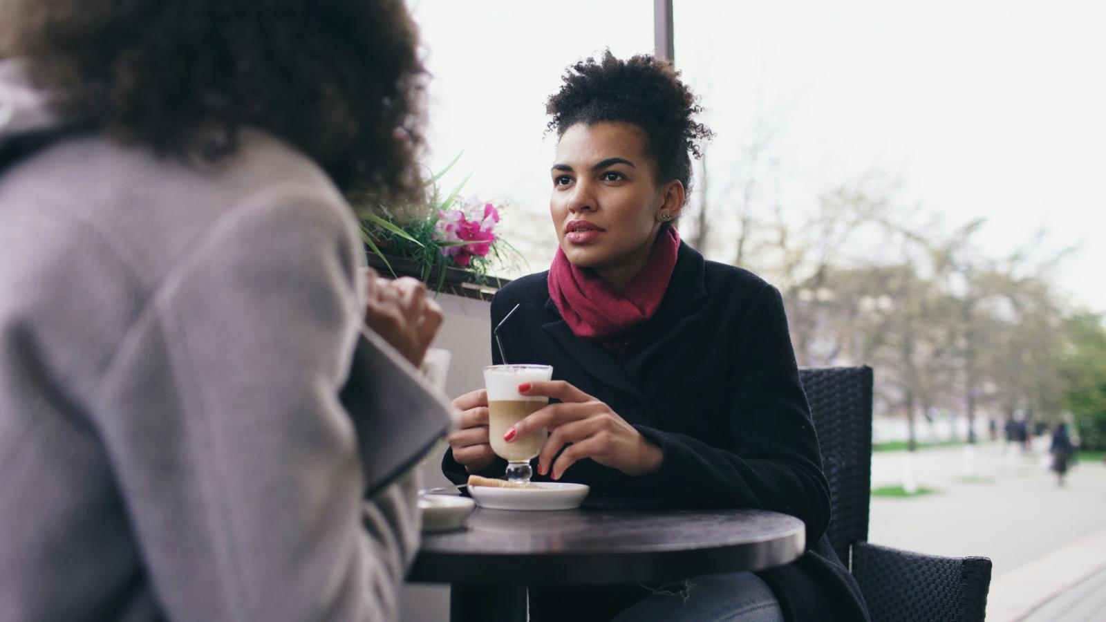 Leadership Circle: two women talking over coffee at a café