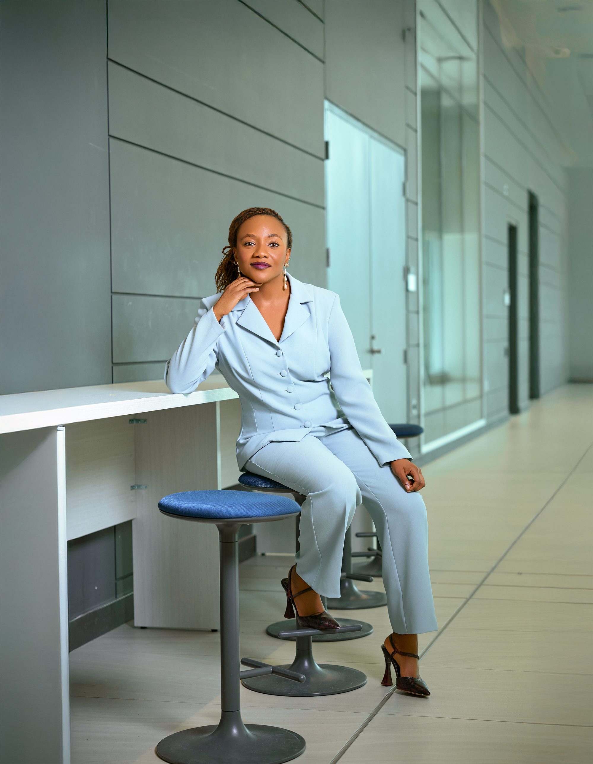 Aisha Umar, Founder of WILLNET, seated in a modern office