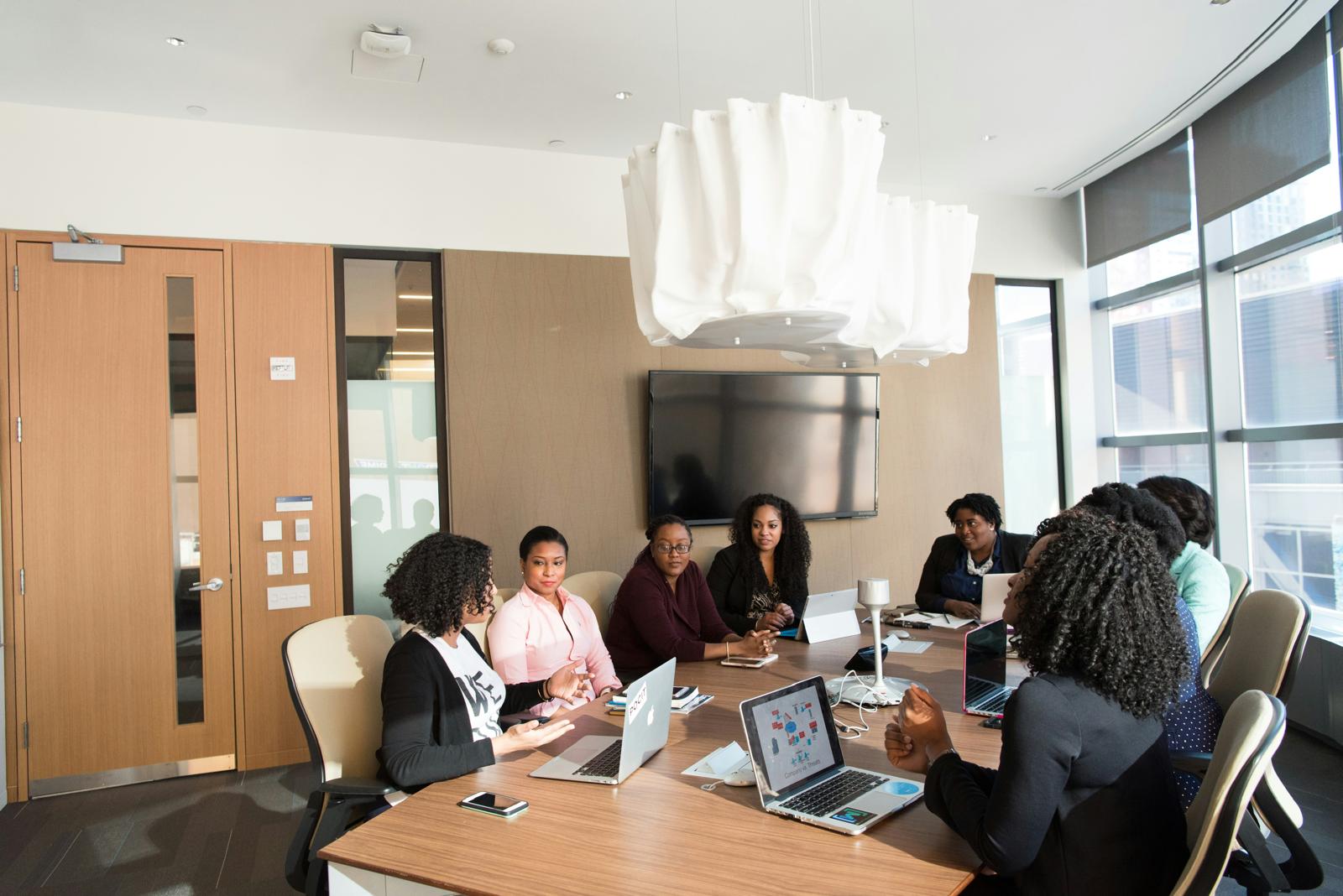 Mentorship Circles: women meeting around a conference table